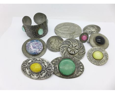 Nine pewter brooches, a ring and a bangle