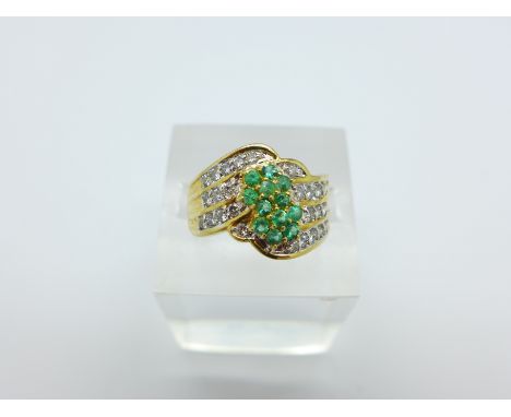 An 18ct gold, diamond and emerald ring, 6.8g, R