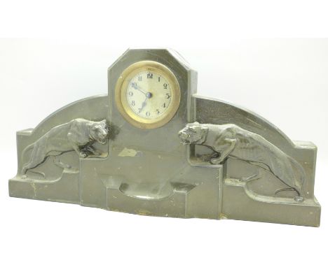 A 1920's Art Deco cast metal mantel clock,(re-finished)
