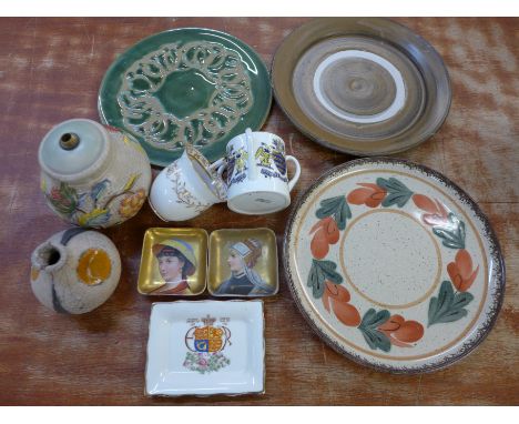 A Poole pottery table lamp base, a pair of continental portrait dishes and other studio pottery