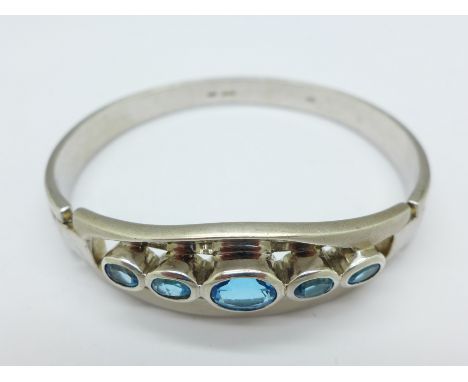 A silver and blue stone bangle, 45g