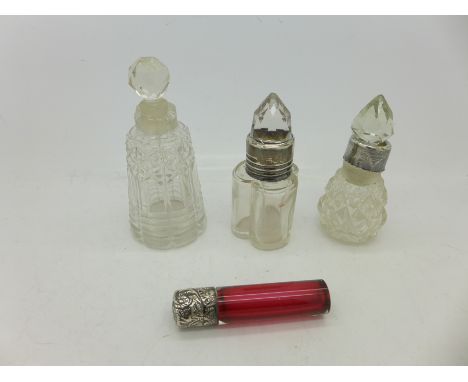 A Victorian ruby glass scent bottle with silver top, a/f, and three other scent bottles, one lacking silver collar