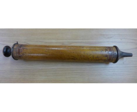 A wooden pump, marked G.P.O. and with broad arrow, F.M.32505