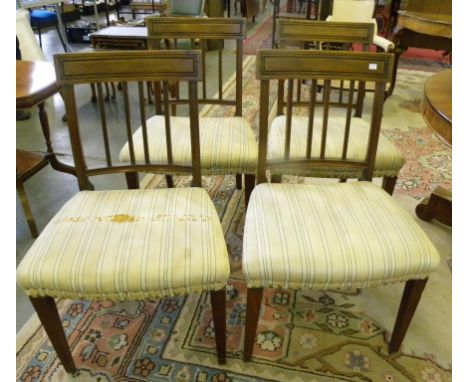 A SET OF FOUR REGENCY MAHOGANY DINING CHAIRS WITH REEDED STICK SPLAT, ON SQUARE TAPERED LEGS