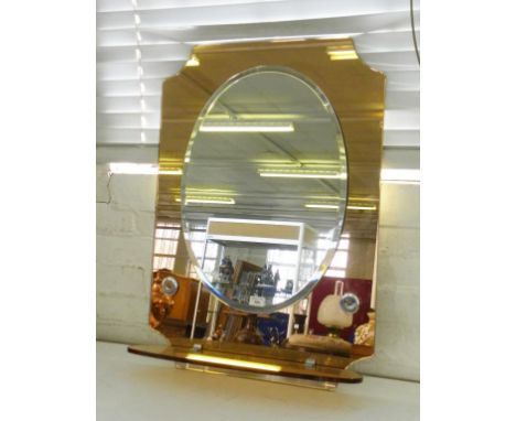 A 1950'S CORAL TINTED GLASS BATHROOM MIRROR WITH OVAL PLATE AND SHELF