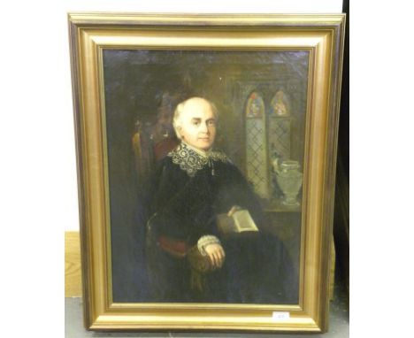 19TH CENTURY SCHOOL, PORTRAIT OF A MAN SEATED THREE QUARTER LENGTH IN AN INTERIOR HOLDING A VOLUME OF SHAKESPEARE, OIL ON CAN
