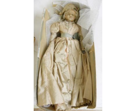 A VICTORIAN WAX SHOULDER HEADED DOLL WITH PADDED BODY IN PERIOD SATIN DRESS, HAT AND UNDERGARMENTS AND TWO GERMAN COMPOSITION