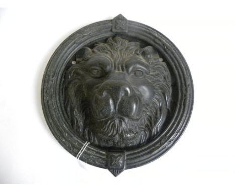 A PATINATED BRASS LION MASK DOOR KNOCKER