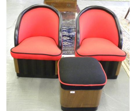 A PAIR OF 1950'S EBONISED BUCKET SHAPED CHAIRS UPHOLSTERED IN BLACK PIPED RED WOOL AND A SIMILAR SQUARE POUFFE