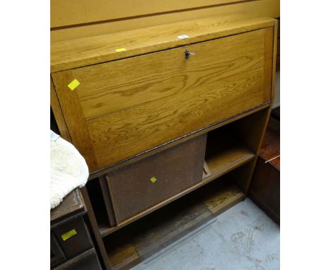 A vintage lightwood bureau bookcase