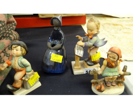 Three Goebel figures together with another