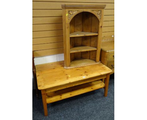 A pine coffee table with lower shelf together with a pine open hanging corner cupboard with acorn & leaf carving decoration