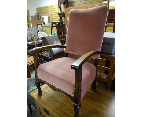 A vintage armchair in buttoned pink upholstery