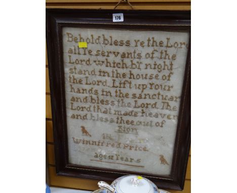 A vintage framed sampler with a biblical passage