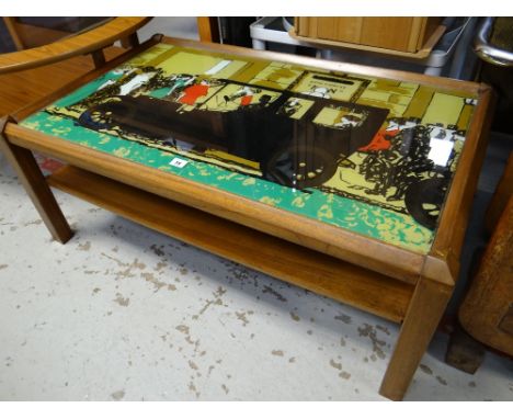 A mid-century glass top pictorial Long John coffee table depicting vintage motorcar & crowds of people in a street