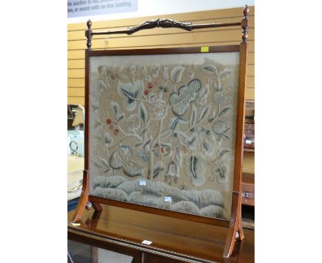 A good embroidered fire screen in a mahogany surround