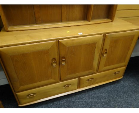 An Ercol blonde compact sideboard with two drawers & three cupboards