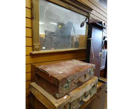 A modern gilt over mantel mirror & two vintage suitcases (distressed)