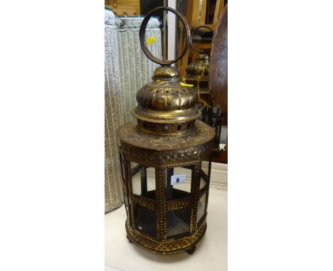 An antique brass & glass swinging lantern