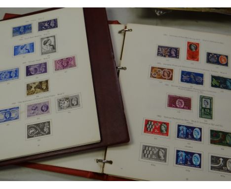 Four vintage stamp albums