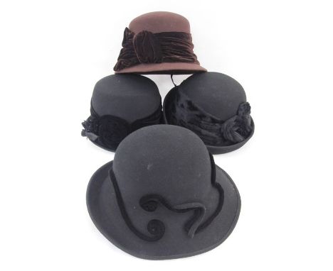 Quantity of hats by Sandra Phillipps including straw hats with linen and raw silk decorations and Sandra Phillipps black felt