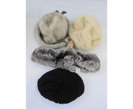 Blonde mink hat with a satin bow labelled 'Mitzi Lorenz', a grey mink hat also labelled 'MitziLorenz', a rabbit scarf and a P