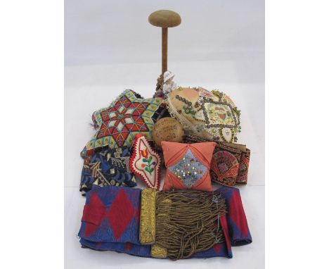 Sweetheart pincushion WWI, another vintage beaded pincushion, a hat/wig stand with a ceramic female figure, various embroider