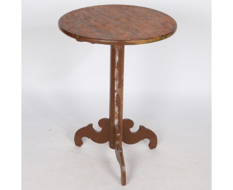 A 20th century French painted pine occasional table, the circular top above a octagonal column and a tripod base, 73.5cm high