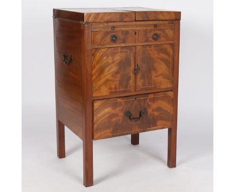 A 19th century mahogany washstand, having a boxwood strung top opening to reveal wash basin stand, the front having a faux dr