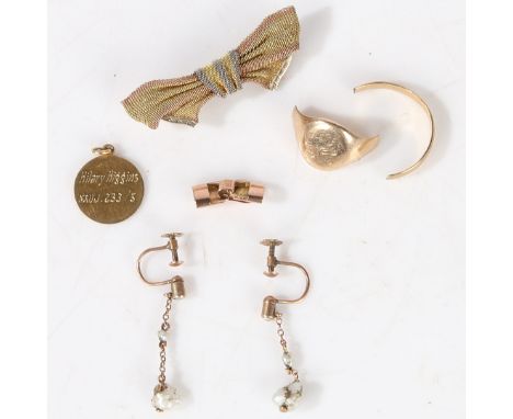 to include a bow form brooch, a circular disc pendant, a signet ring in two pi8eces, a clasp and a pair of blister pearl set 