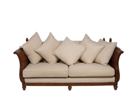 A 20th century Knowle drop end sofa, the mahogany frame with cane sides, and having a upholstered back and seat and wooden fi