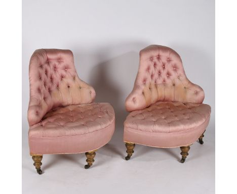 A pair of 19th century button back corner saloon chairs, having buttoned backs and seats raised on turned gilt legs and casto