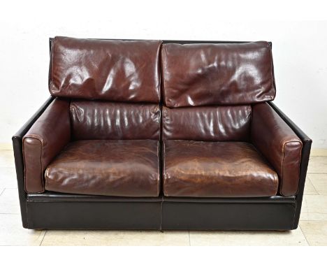 Italian 2-seater leather design sofa. Baxter Fashioned Leather. Two-tone brown leather. With reading subjects. Second half of