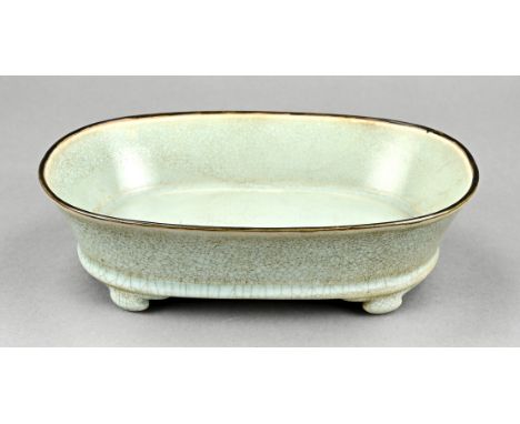 Chinese porcelain celadon planter with text on the bottom. Dimensions: 7 x 23.5 x 16.5 cm. In good condition.