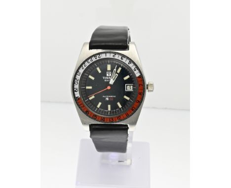 Vintage Tissot automatic watch, PR516, with a bezel with hour display. The watch has a black dial with a blue-green glow. The