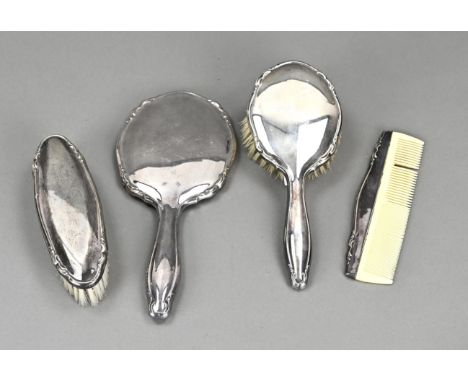 Silver toilet set, 835/000, 4 pieces with a jug, 2 brushes and a mirror. Contoured model. Comb is missing a tooth. Slightly d