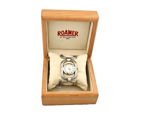 Box containing a vintage ladies' watch marked Roamer, mechanical with wide tooled rectangular links. Width 35mm. length 18 cm