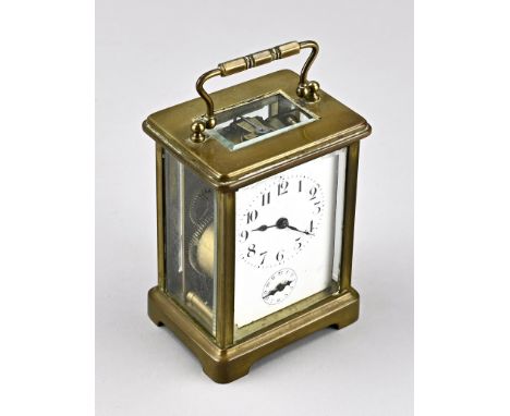 Antique French travel alarm clock made of brass with striking mechanism on bell. Circa 1900. Size: 12 cm. In good condition.