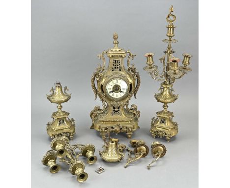 Three-piece antique French clock set made of brass with tendrils. Circa 1880. Eight-day movement, half-hourly striking, sprin