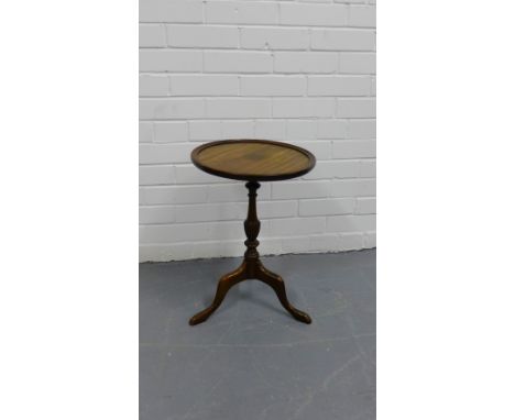 Mahogany and brass inlaid wine table on tripod support