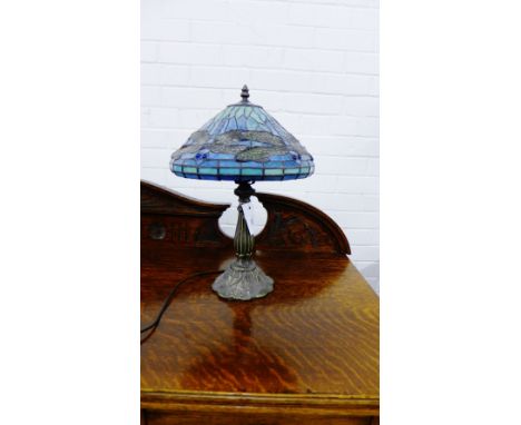 A contemporary bronzed effect and stained glass Tiffany style table lamp and shade 