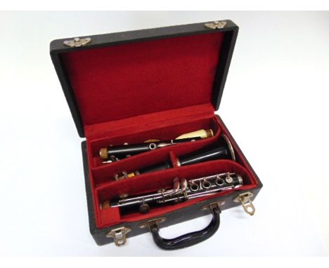 A CLARINET in a fitted case.