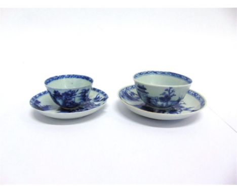 TWO NANKING CARGO TEA BOWLS AND SAUCERS,  each typically decoarted with coastal landscape scenes and bearing old Christie's l