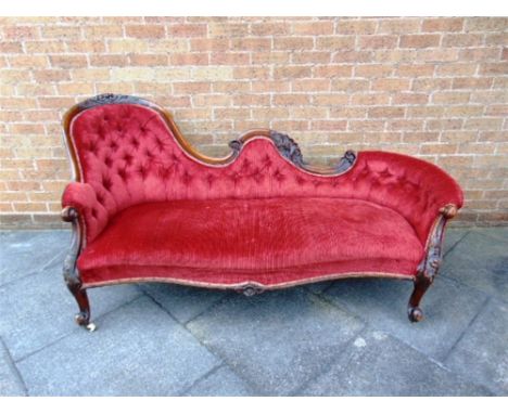 A VICTORIAN CARVED MAHOGANY BUTTON UPHOLSTERED CHAISE LONGUE  on cabriole supports, 193cm long 88cm deep 91cm high 