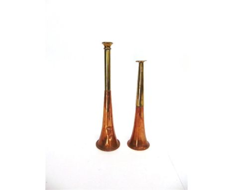 A COPPER AND BRASS MOUNTED HUNTING HORN 24.5cm long; and another smaller hunting horn, 20.5cm long (2)