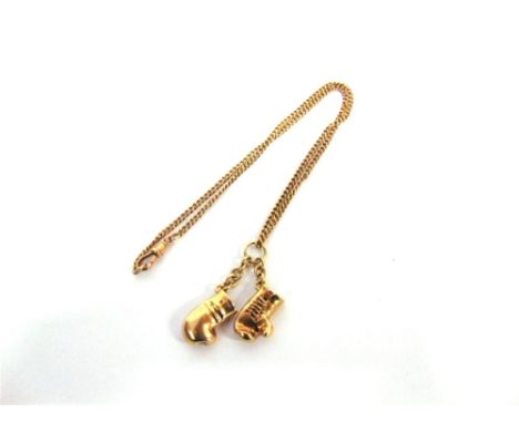 A PAIR OF 9 CARAT GOLD BOXING GLOVES on a chain, 29.6g gross