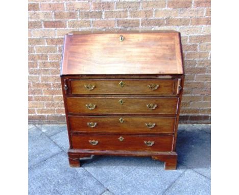 A 19TH CENTURY MAHOGANY BUREAU,  the fitted interior with marquetry decoration and two secret drawers, over four long drawers