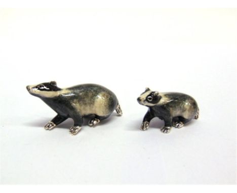 A PAIR OF SATURNO SILVER AND ENAMEL BADGERS,  the larger approximately 6cm long