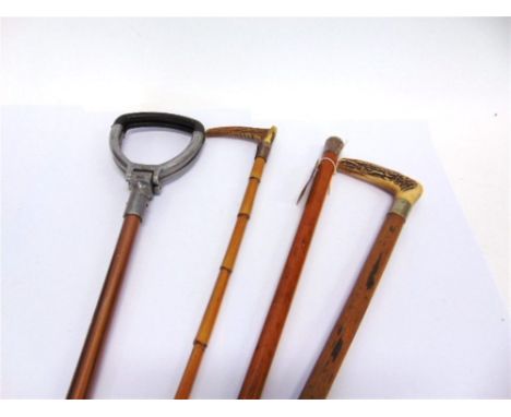 A MALACCA CANE with Chinese silver finial marked WH for Wang Hing and engraved Chinese characters; a riding crop with a horn 