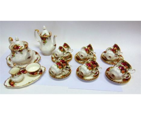 ROYAL ALBERT 'OLD COUNTRY ROSES':  a six setting tea and coffee service comprising teapot, coffee pot, six tea cups and sauce